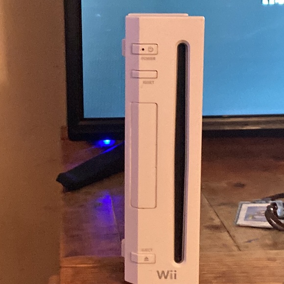 Wiii gaming console comes with controller and cables needed for setup. - Picture 2 of 4